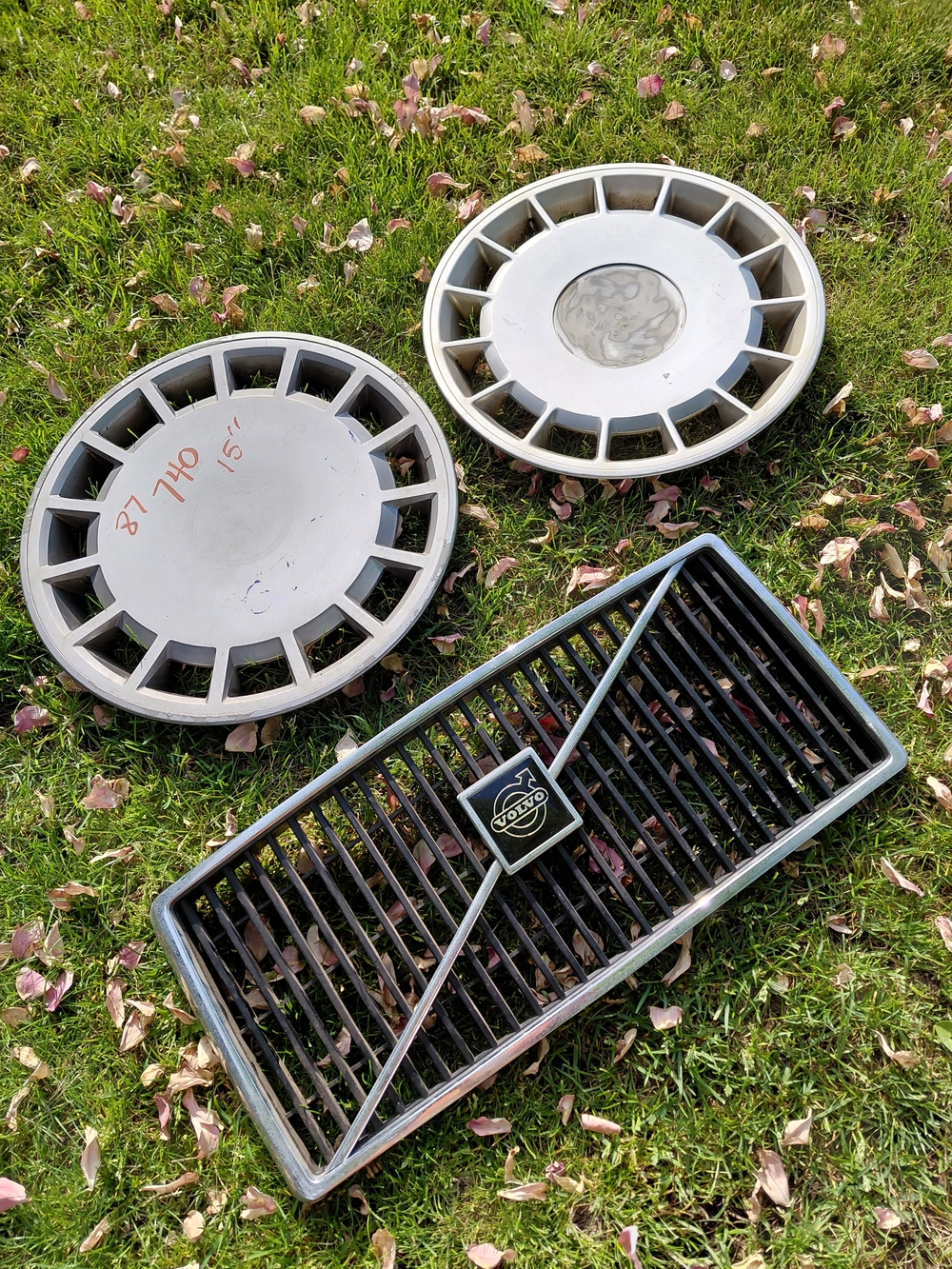 Vintage 80s spare Volvo grill & hubcaps - 240 Station wagon & 740